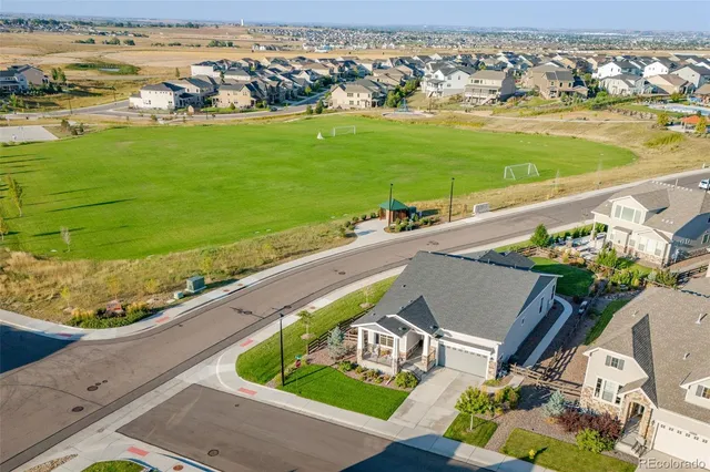 an aerial view of a house with a ocean view