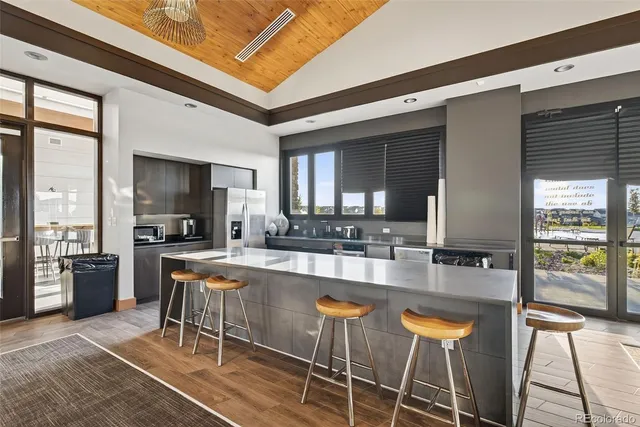 a large kitchen with a table and chairs