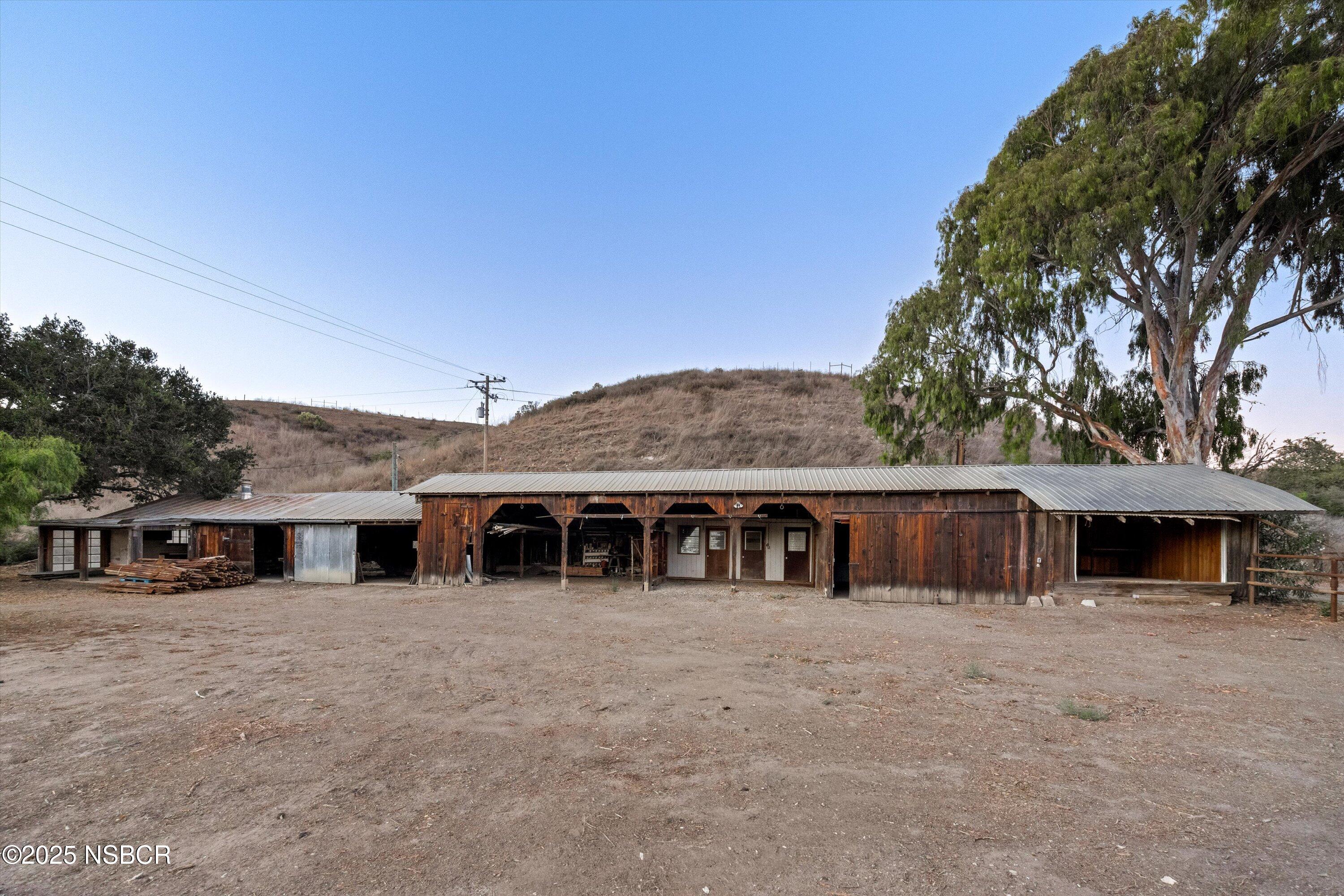 4375 Sweeney Road Lompoc, CA 93436 - Photo 58 of 70 a view of a house with large windows and a small yard
