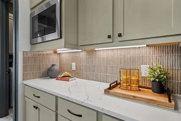 a dining room with furniture a window and kitchen view