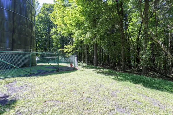 a house with trees in the background
