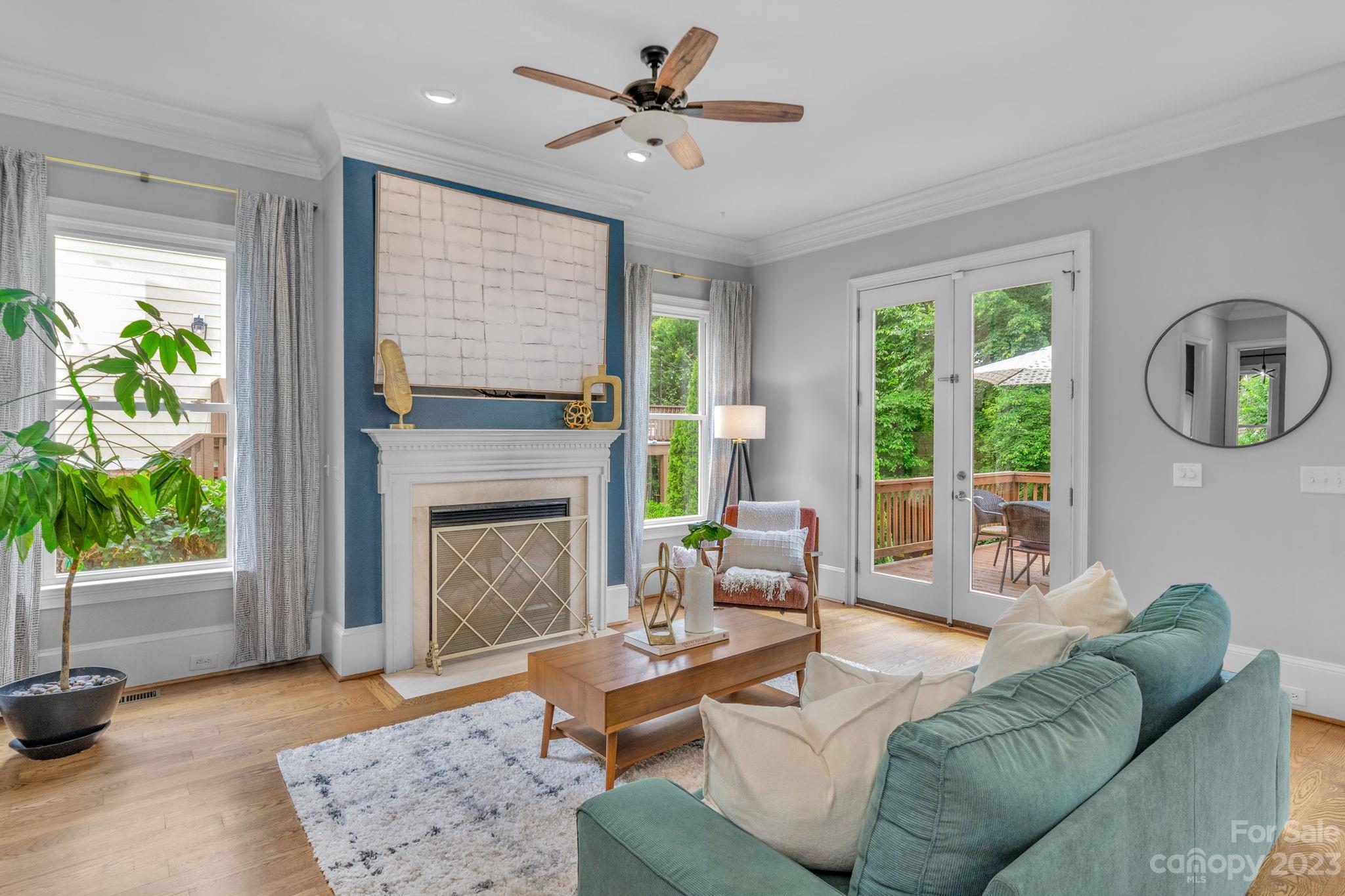 1320 Ivey Drive Charlotte, NC 28205 - Photo 12 of 45 a living room with furniture a window and a fireplace