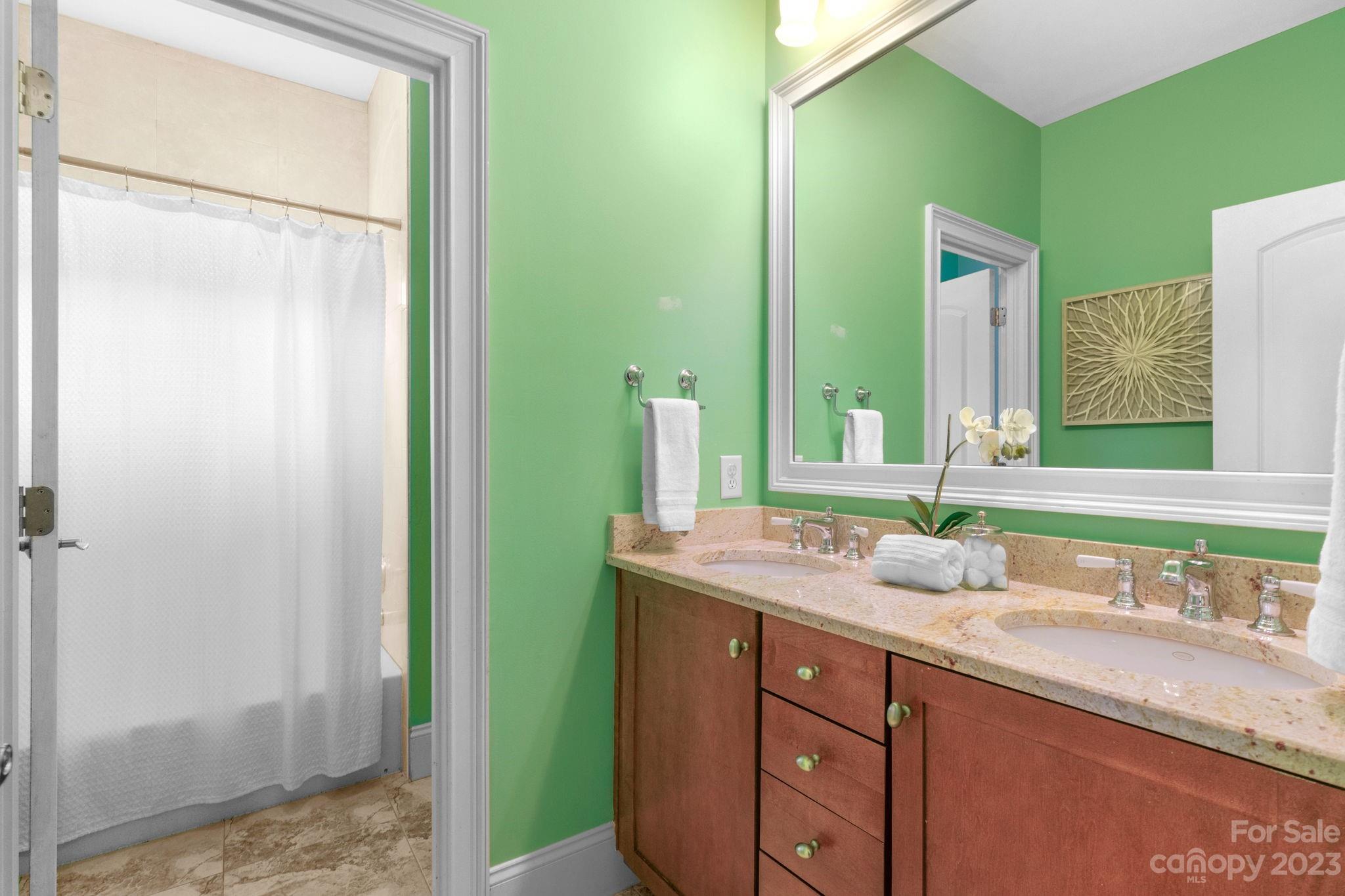 1320 Ivey Drive Charlotte, NC 28205 - Photo 28 of 45 a bathroom with a granite countertop sink and a mirror