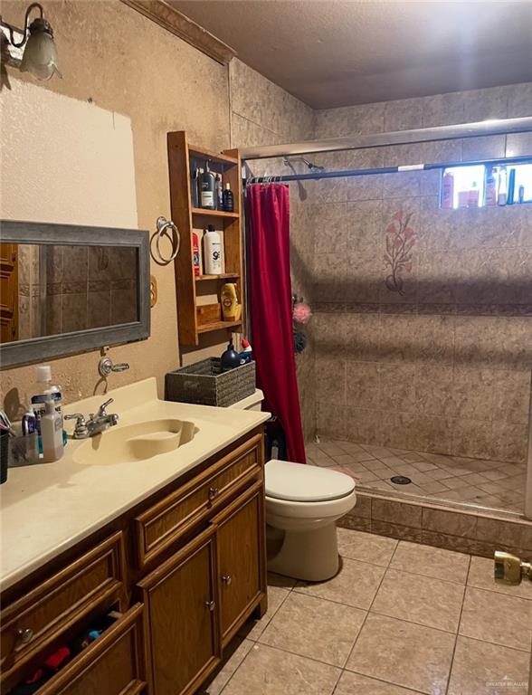 4249 Terra Street Rio Grande City, TX 78582 - Photo 6 of 6 a bathroom with a sink and a mirror