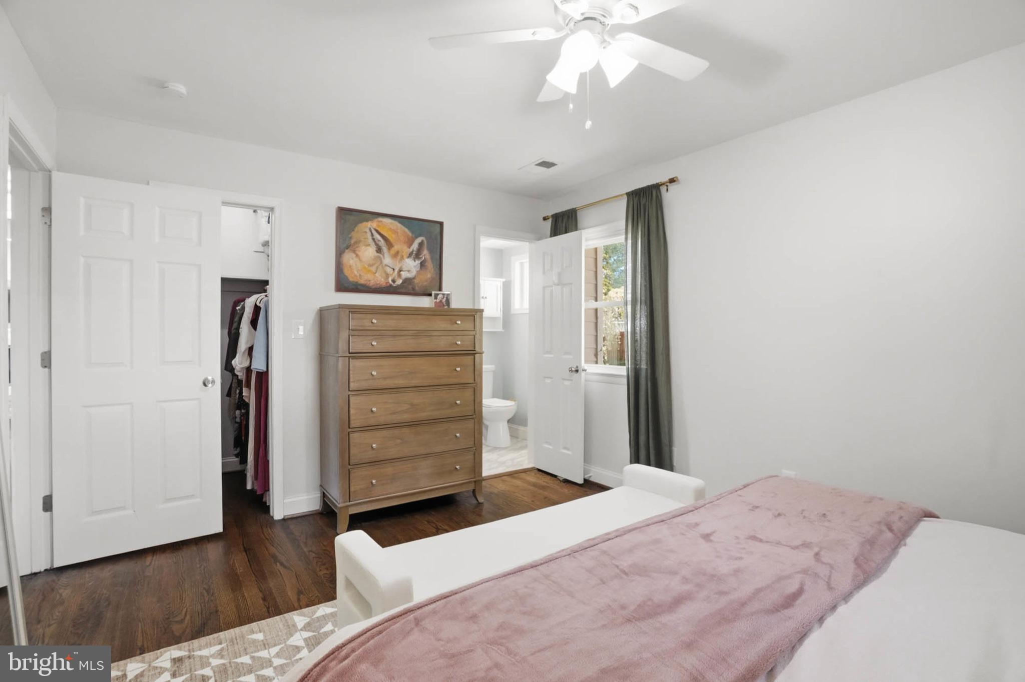 810 Venice Drive Silver Spring, MD 20904 - Photo 13 of 33 a bedroom with a bed and a chandelier