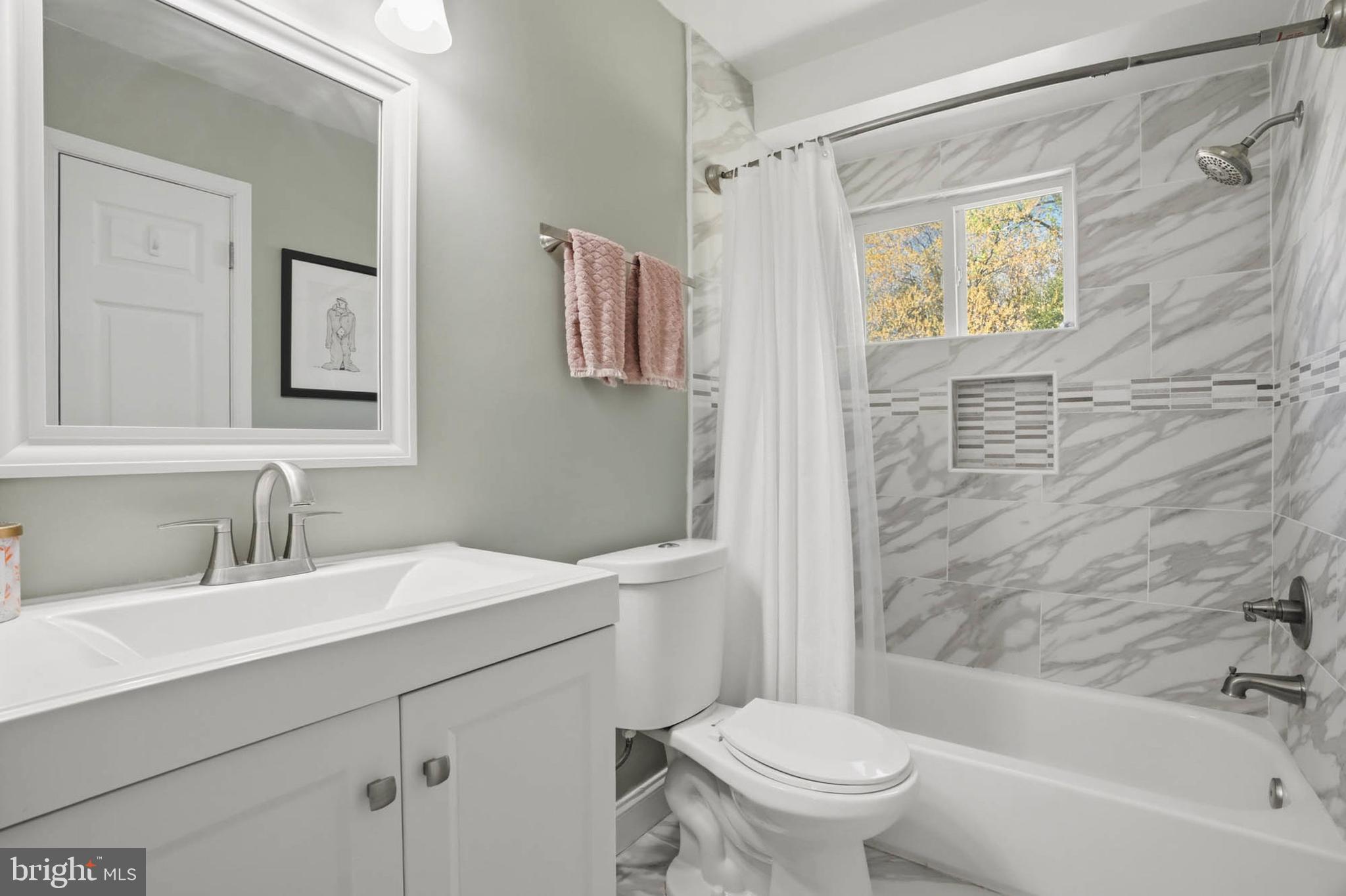 810 Venice Drive Silver Spring, MD 20904 - Photo 19 of 33 a bathroom with a sink toilet and shower
