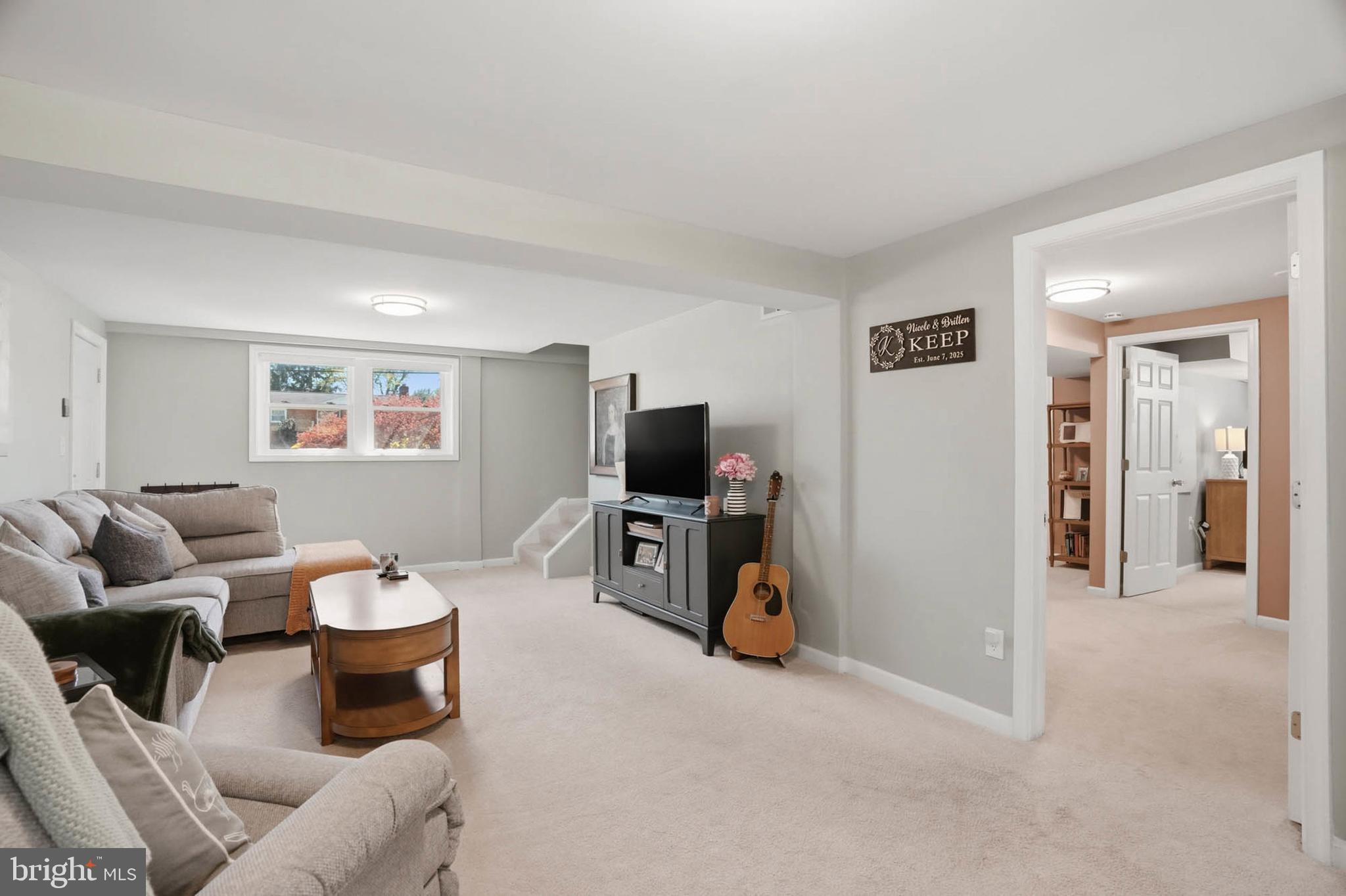 810 Venice Drive Silver Spring, MD 20904 - Photo 21 of 33 a living room with furniture and a flat screen tv