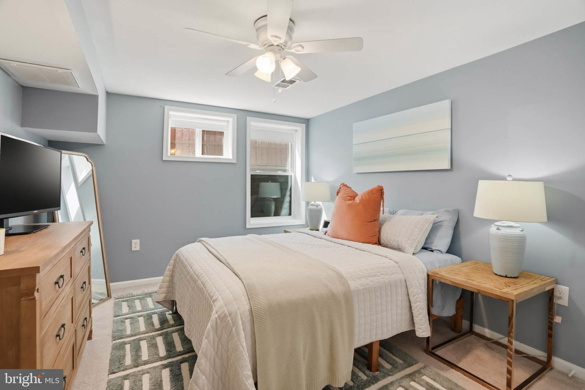 810 Venice Drive Silver Spring, MD 20904 - Photo 24 of 33 a bedroom with a bed and a flat screen tv