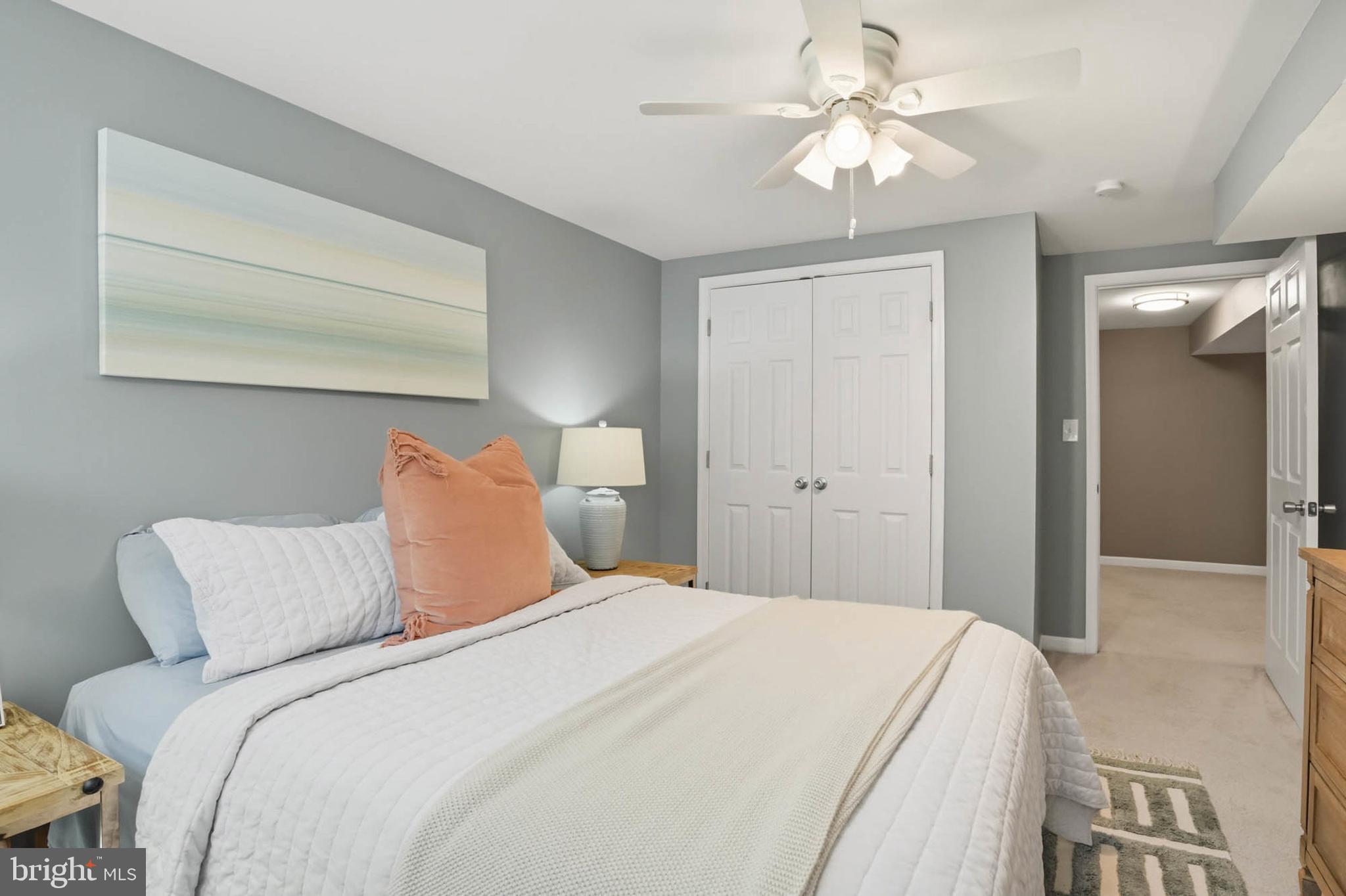 810 Venice Drive Silver Spring, MD 20904 - Photo 25 of 33 a bedroom with a bed and a chandelier