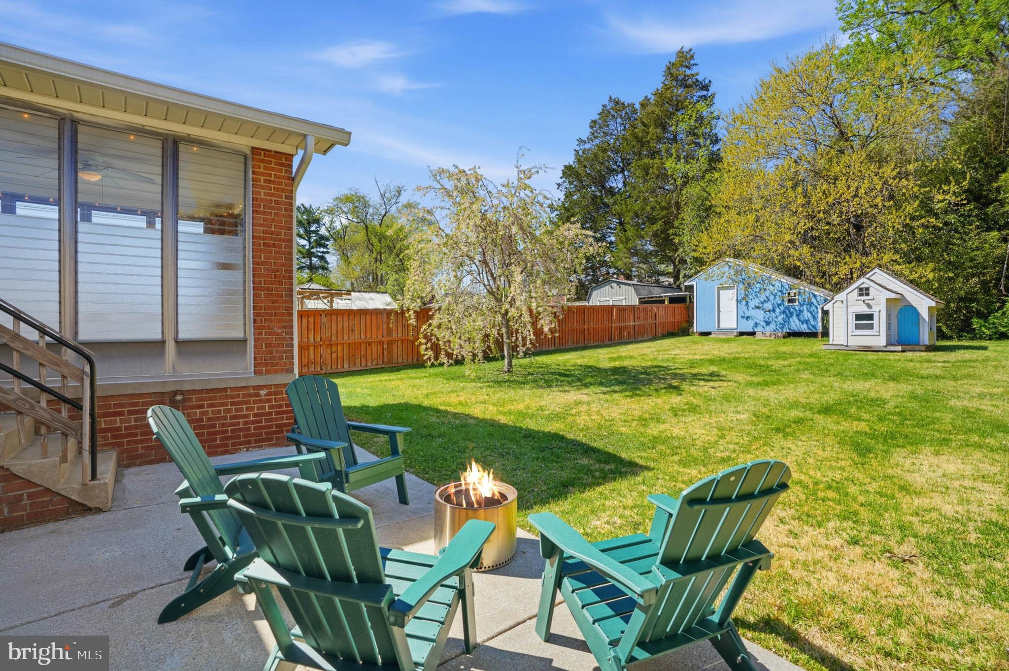 810 Venice Drive Silver Spring, MD 20904 - Photo 31 of 33 a view of a patio with table and chairs and potted plants