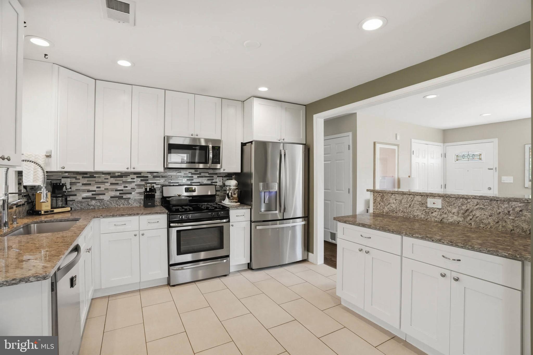 810 Venice Drive Silver Spring, MD 20904 - Photo 10 of 33 a kitchen with cabinets a sink and stainless steel appliances