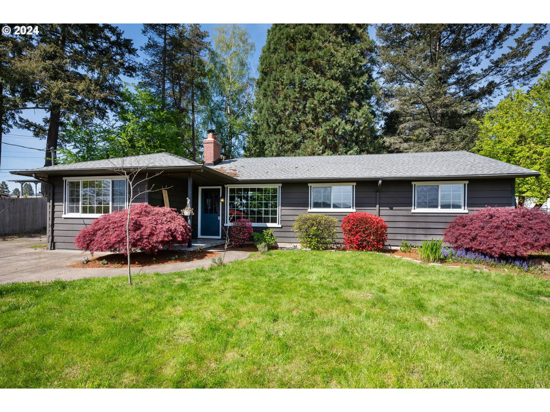 8511 Southeast Barbara Welch Road Portland, OR 97236 - Photo 1 of 30 a front view of a house with a garden