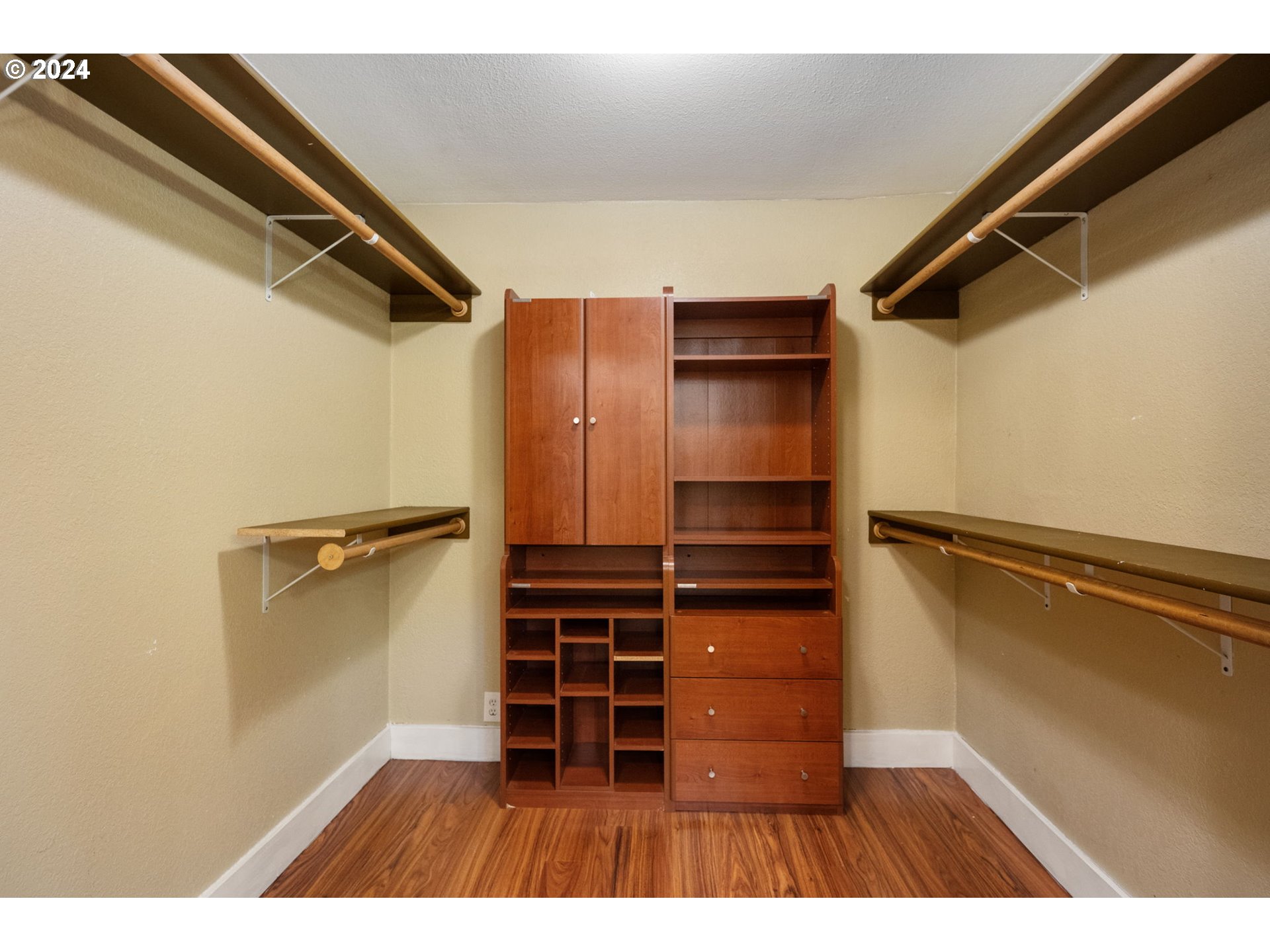 8511 Southeast Barbara Welch Road Portland, OR 97236 - Photo 14 of 30 a view of walk in closet with empty racks