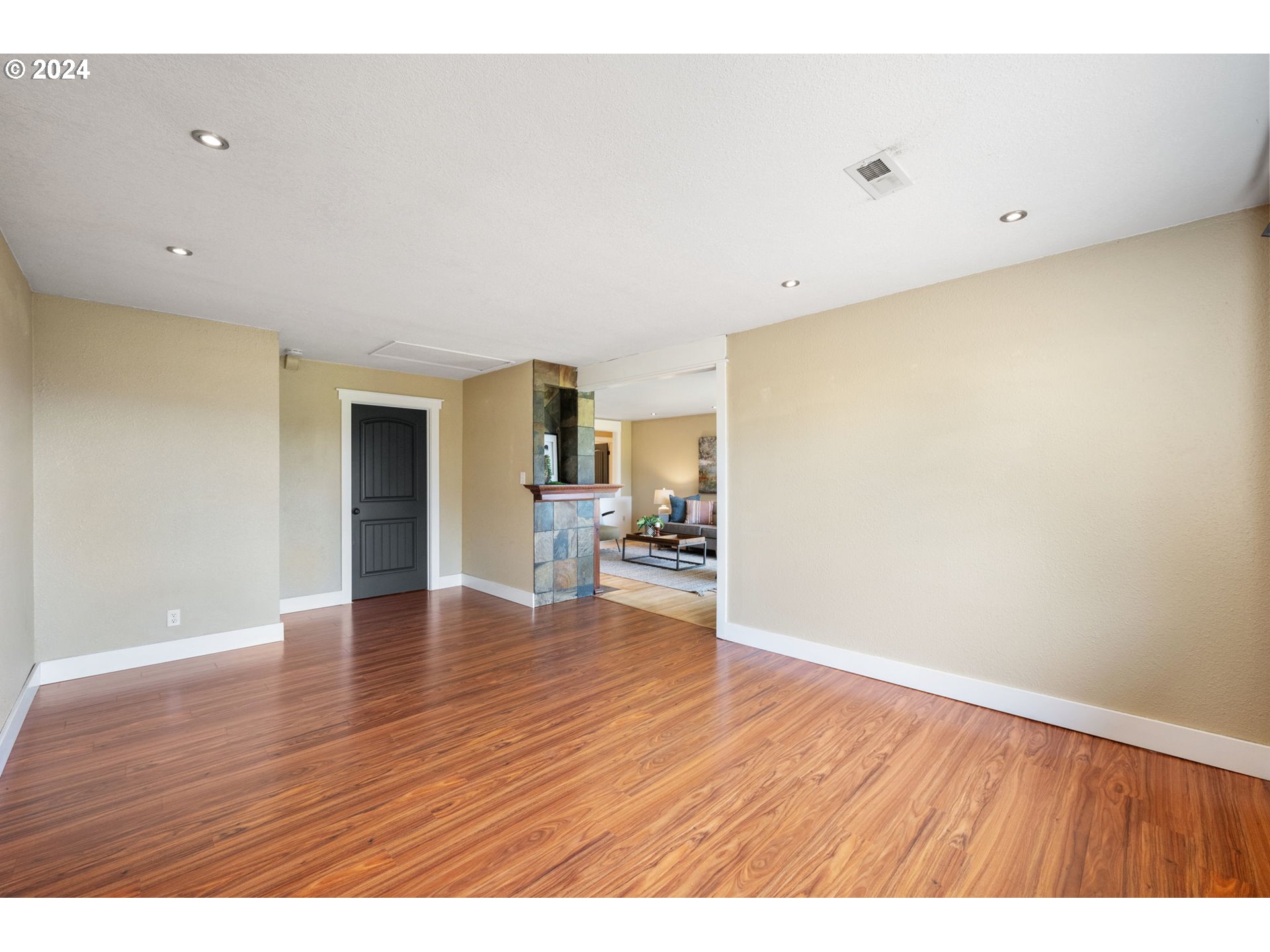 8511 Southeast Barbara Welch Road Portland, OR 97236 - Photo 16 of 30 a view of empty room with wooden floor