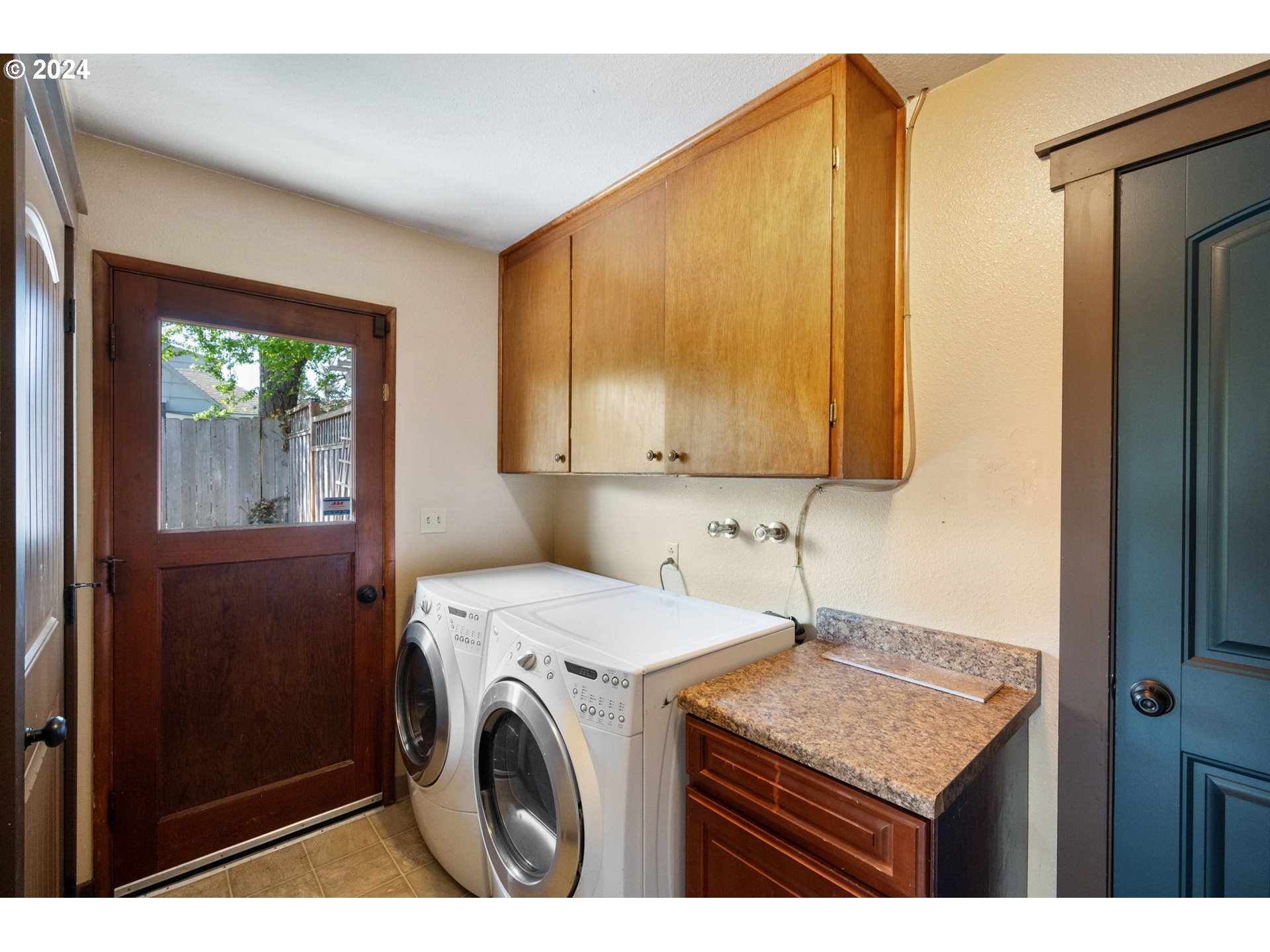 8511 Southeast Barbara Welch Road Portland, OR 97236 - Photo 21 of 30 a utility room with dryer and washer