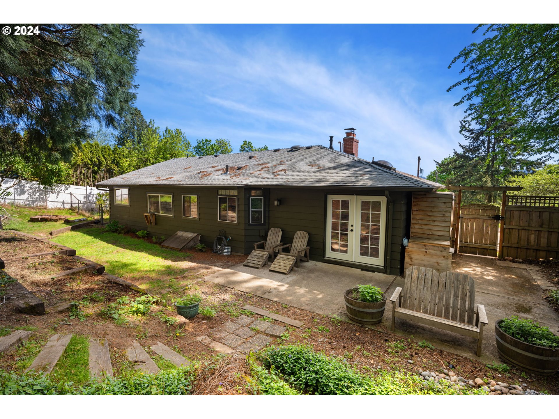 8511 Southeast Barbara Welch Road Portland, OR 97236 - Photo 24 of 30 a view of a house with a yard and sitting area