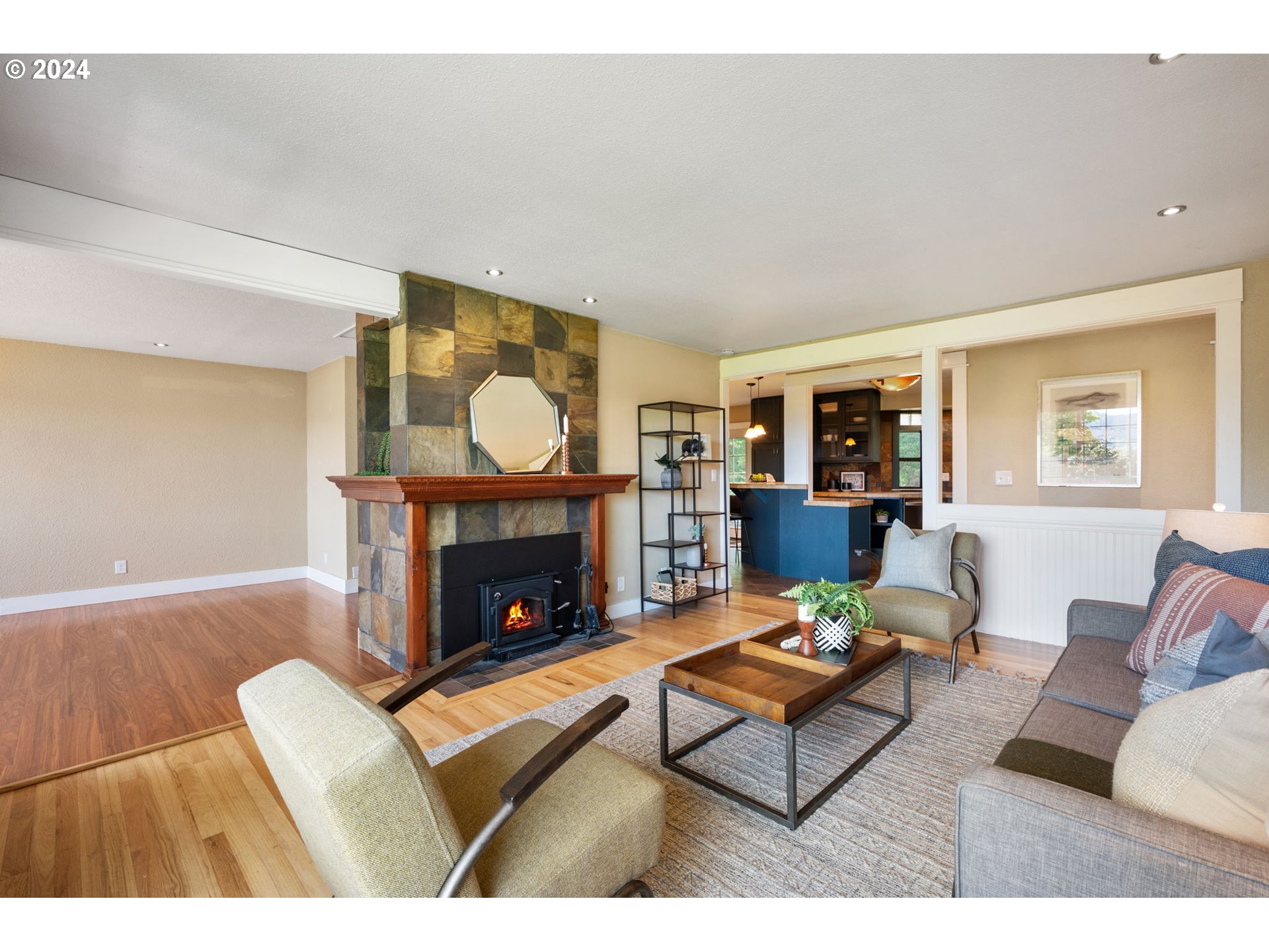 8511 Southeast Barbara Welch Road Portland, OR 97236 - Photo 3 of 30 a living room with furniture a fireplace and a table