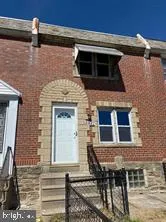 a brick house with a door and a door