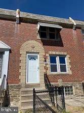 5822 Saul Street Philadelphia, PA 19149 - Photo 1 of 15 a brick house with a door and a door
