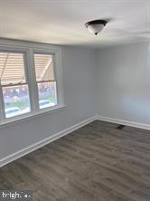 5822 Saul Street Philadelphia, PA 19149 - Photo 11 of 15 wooden floor in an empty room with a window
