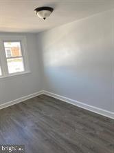 5822 Saul Street Philadelphia, PA 19149 - Photo 12 of 15 an empty room with wooden floor and windows