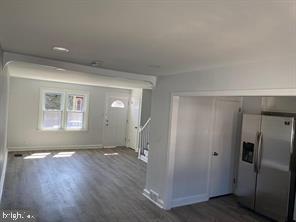 5822 Saul Street Philadelphia, PA 19149 - Photo 5 of 15 a view of empty room with wooden floor and fan