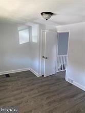 5822 Saul Street Philadelphia, PA 19149 - Photo 7 of 15 a view of an empty room with wooden floor and a window