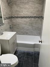 5822 Saul Street Philadelphia, PA 19149 - Photo 9 of 15 a bathroom with a sink a toilet and shower