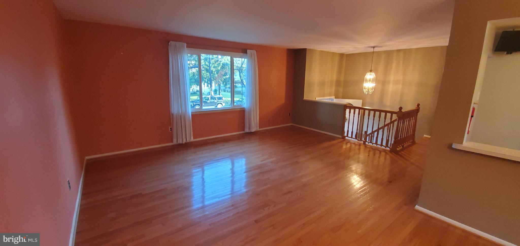 5 Crider Avenue Moorestown, NJ 08057 - Photo 12 of 64 a view of an empty room with wooden floor and a window