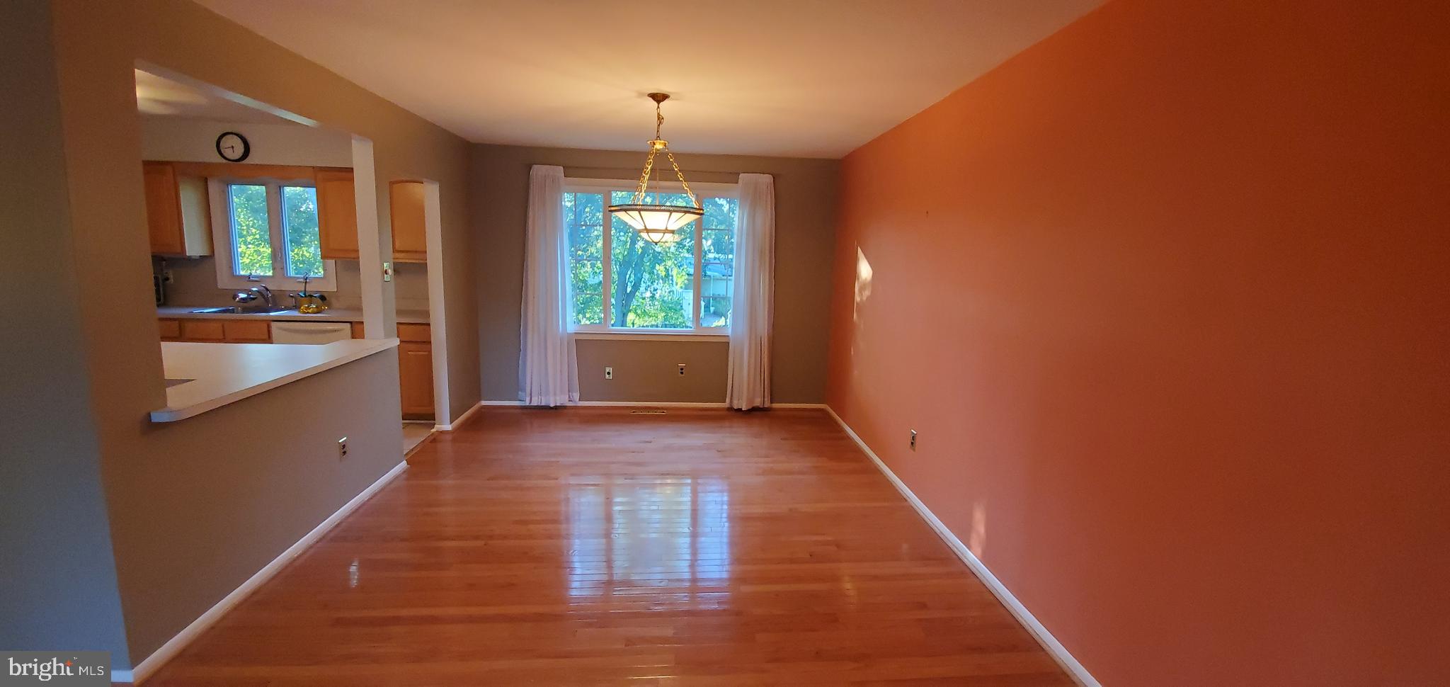 5 Crider Avenue Moorestown, NJ 08057 - Photo 14 of 64 a view of a hallway with wooden floor and chandelier