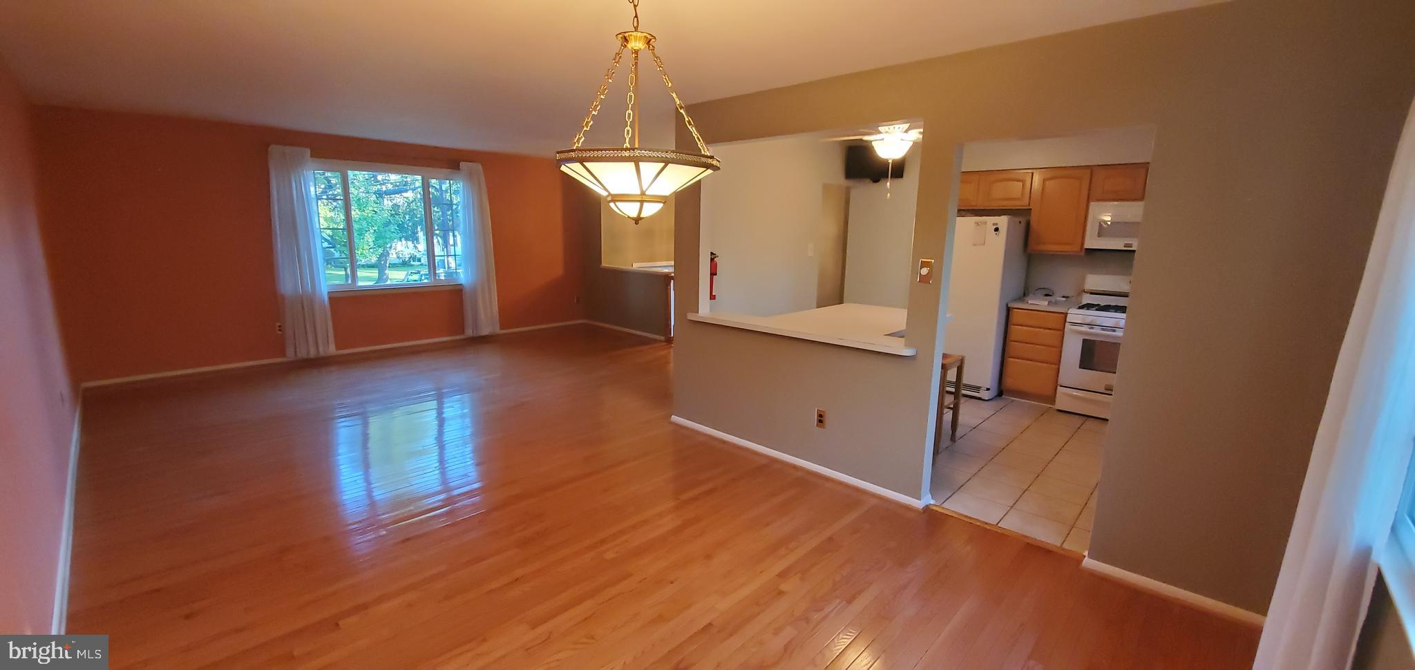 5 Crider Avenue Moorestown, NJ 08057 - Photo 16 of 64 a view of a kitchen with a refrigerator wooden floor and a kitchen