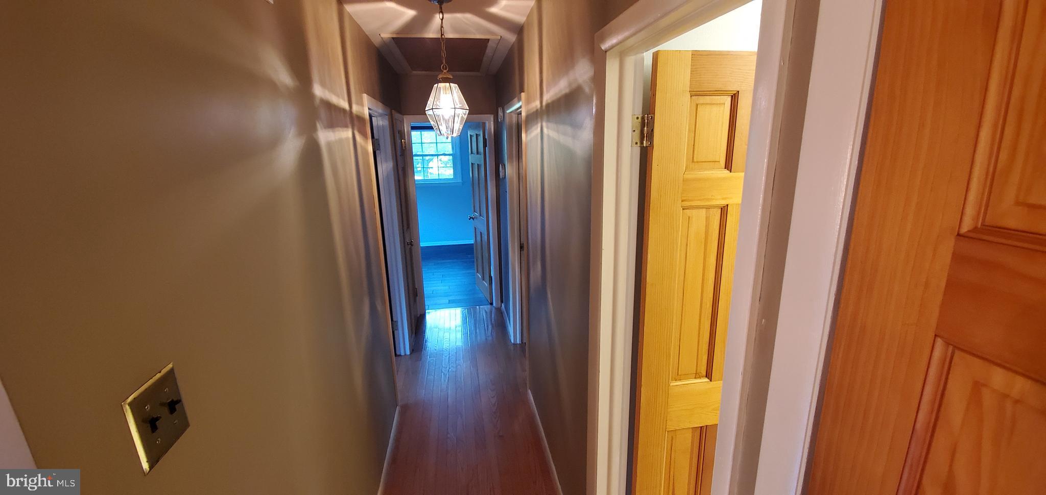 5 Crider Avenue Moorestown, NJ 08057 - Photo 23 of 64 a view of a hallway with wooden floor