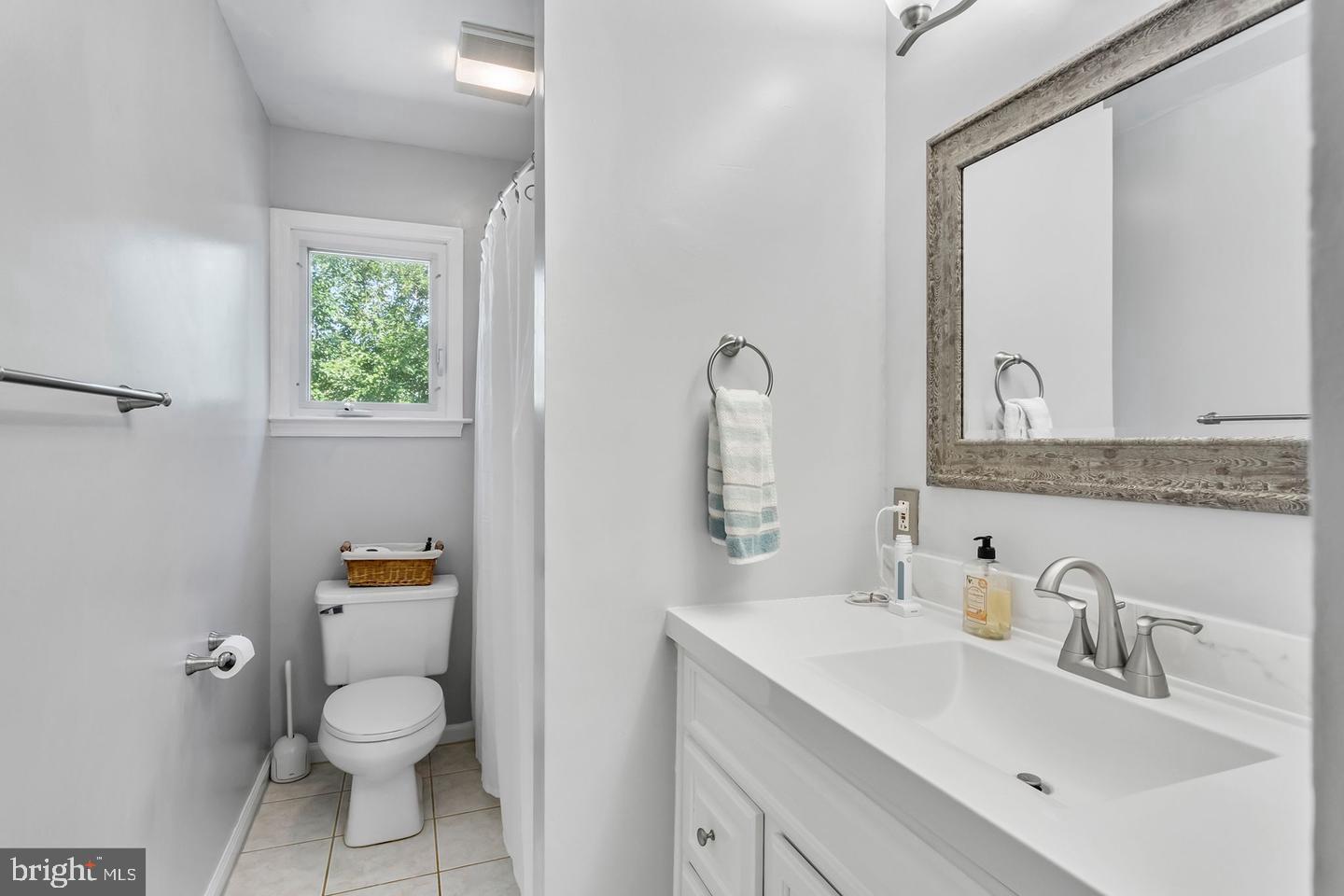 5 Crider Avenue Moorestown, NJ 08057 - Photo 24 of 64 a bathroom with a toilet a sink and mirror