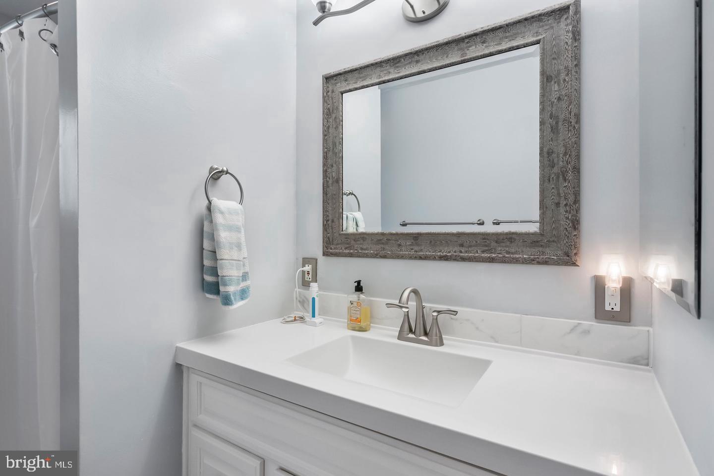 5 Crider Avenue Moorestown, NJ 08057 - Photo 26 of 64 a bathroom with a sink vanity and a mirror