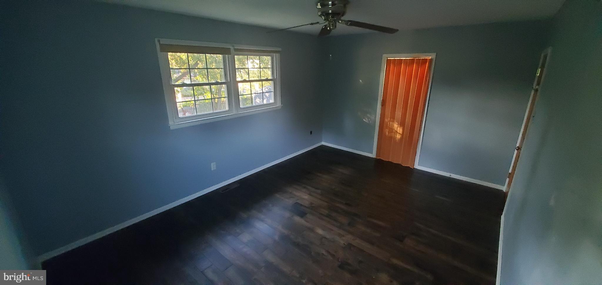 5 Crider Avenue Moorestown, NJ 08057 - Photo 32 of 64 an empty room with wooden floor fan and windows