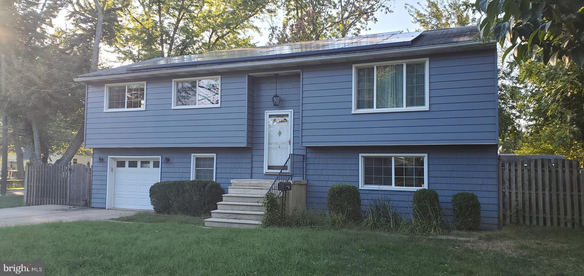 5 Crider Avenue Moorestown, NJ 08057 - Photo 4 of 64 a front view of a house with a garden