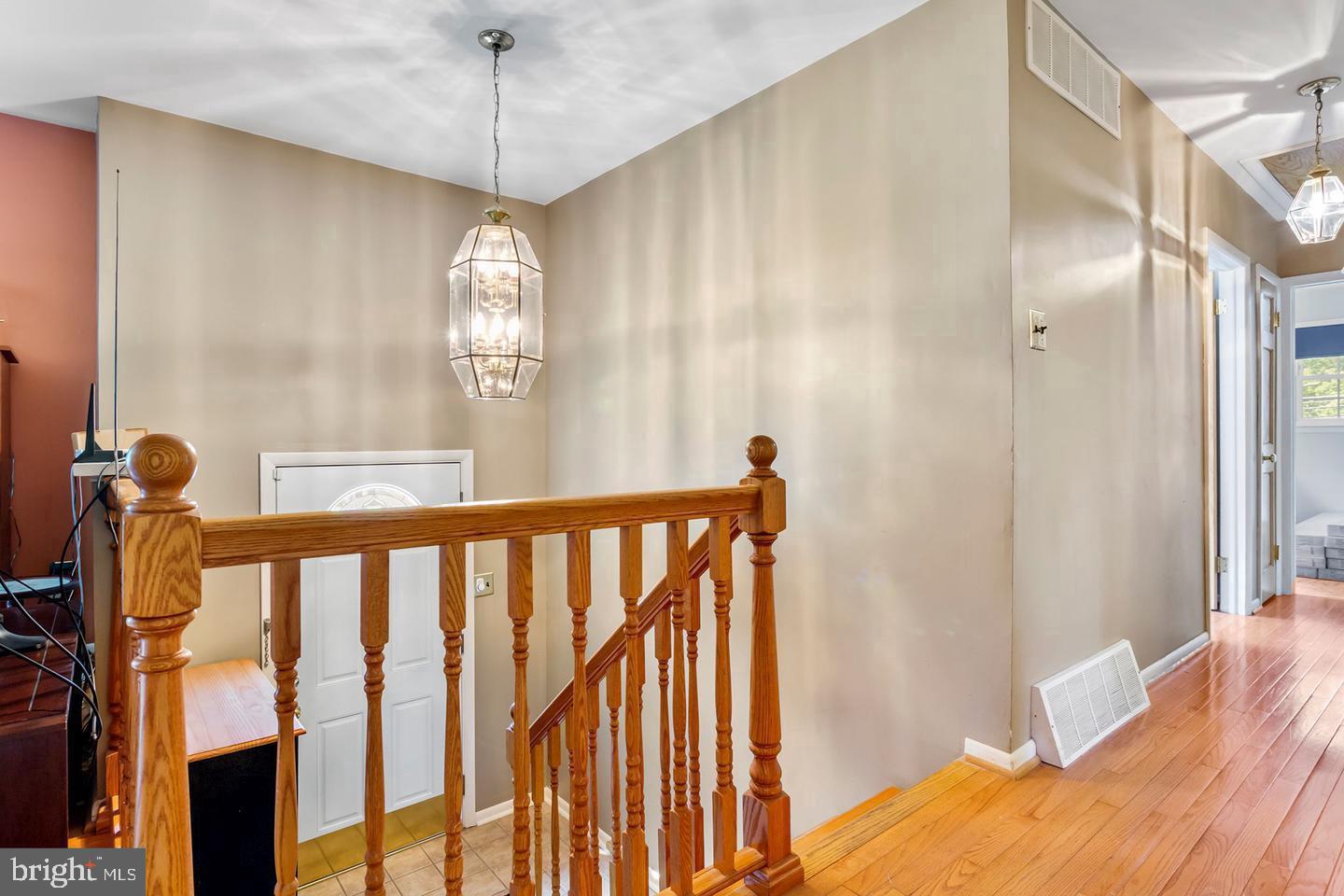5 Crider Avenue Moorestown, NJ 08057 - Photo 41 of 64 a view of a hallway with windows and chandelier
