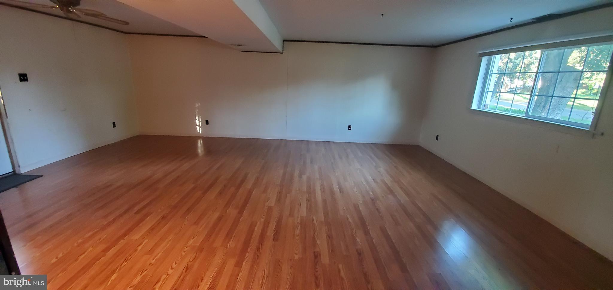 5 Crider Avenue Moorestown, NJ 08057 - Photo 43 of 64 an empty room with wooden floor and windows