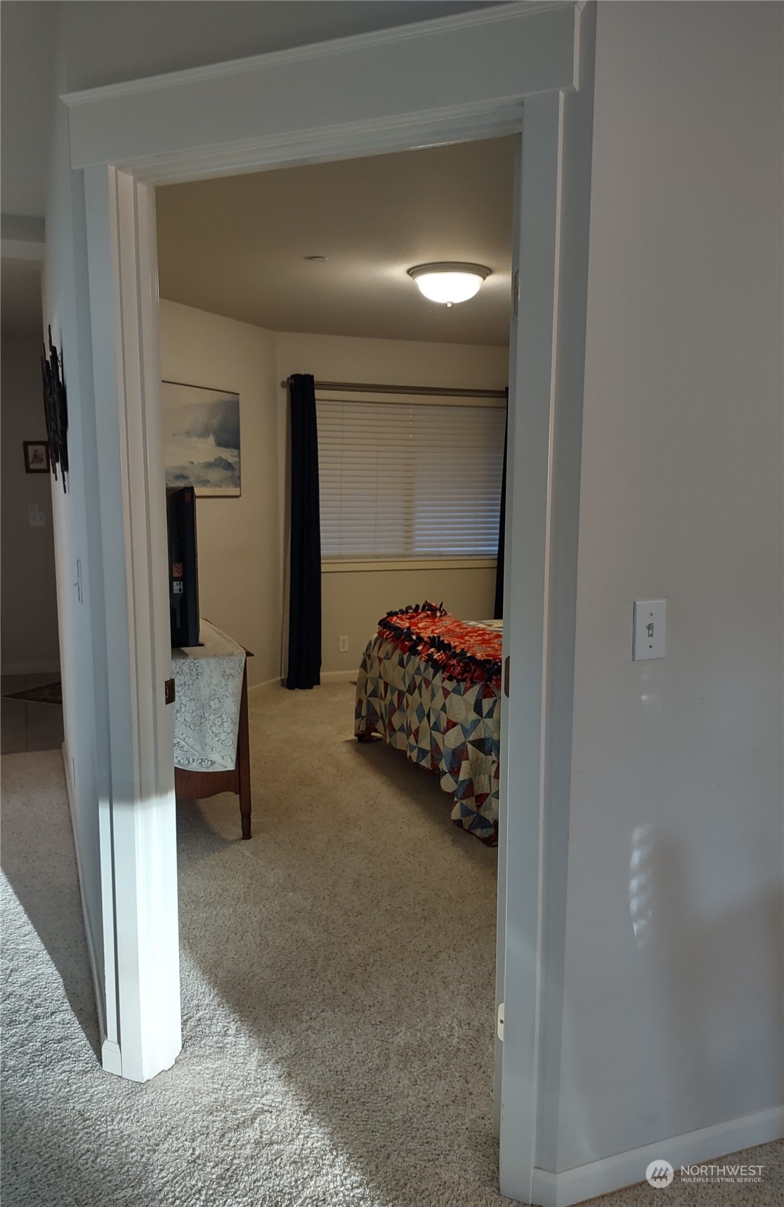 160 East Soderberg Road, Unit G19 Allyn, WA 98524 - Photo 13 of 38 a bedroom with a bed and a window