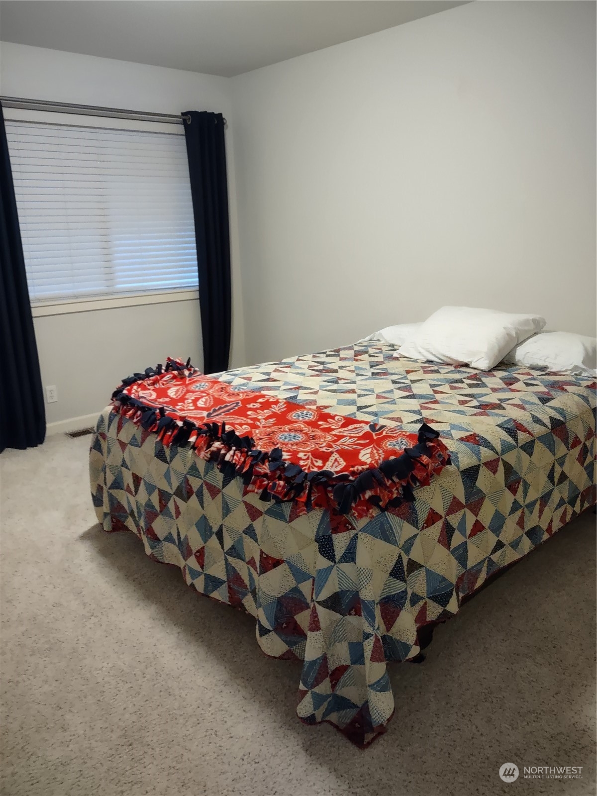 160 East Soderberg Road, Unit G19 Allyn, WA 98524 - Photo 15 of 38 a bedroom with a bed and a baby crib