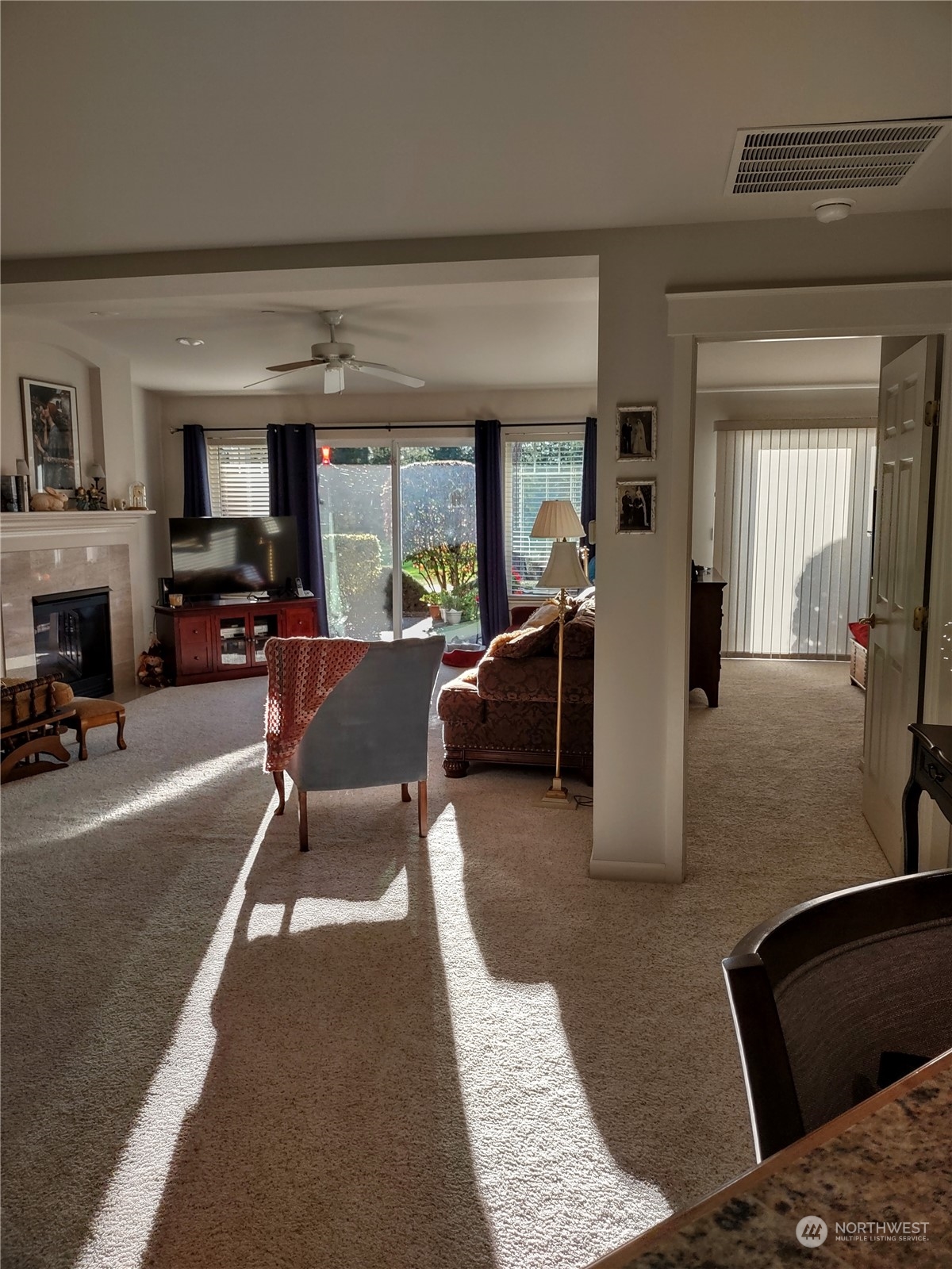 160 East Soderberg Road, Unit G19 Allyn, WA 98524 - Photo 24 of 38 a living room with furniture and a fireplace