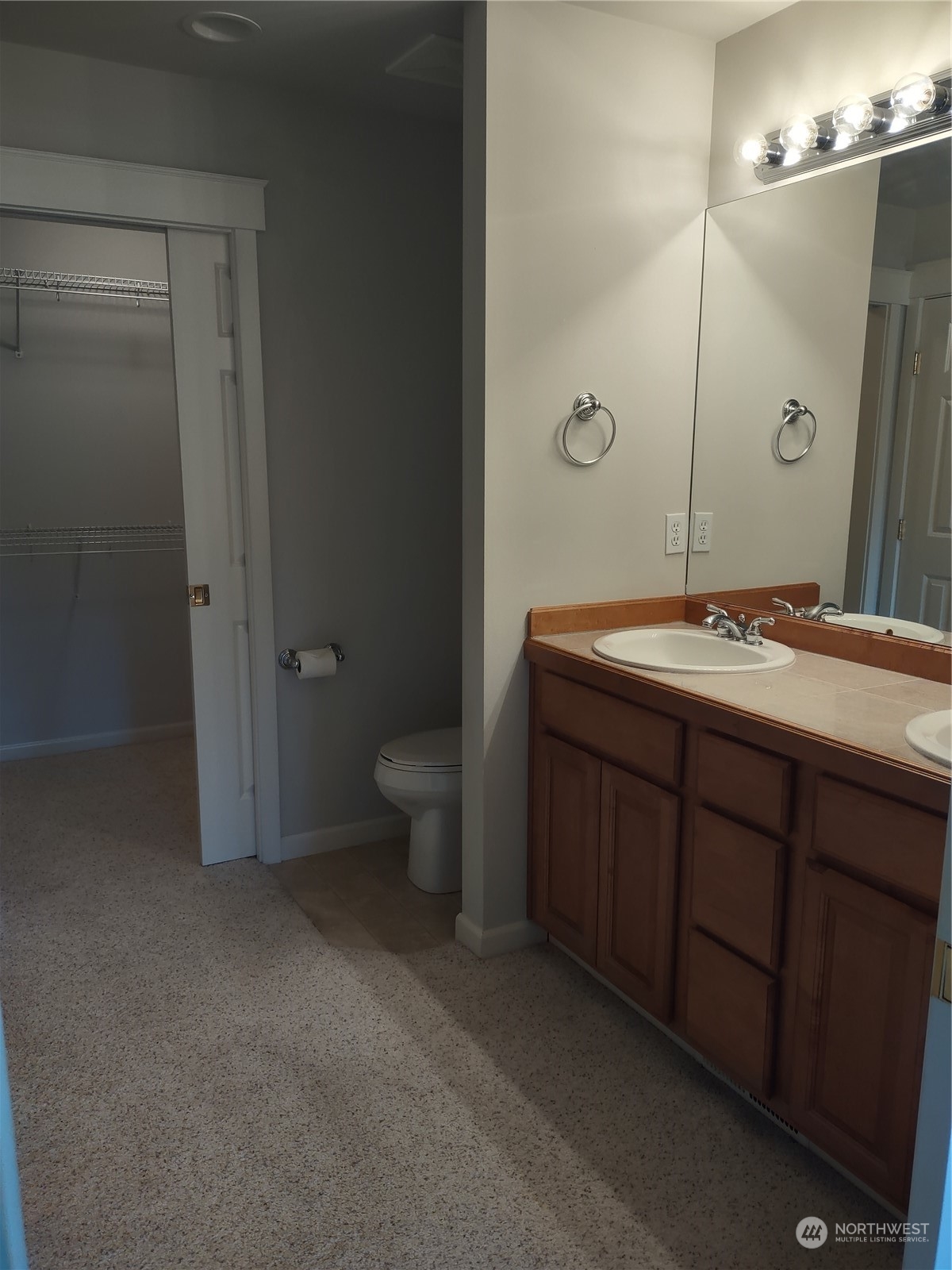 160 East Soderberg Road, Unit G19 Allyn, WA 98524 - Photo 29 of 38 a spacious bathroom with a granite countertop sink a toilet and a mirror
