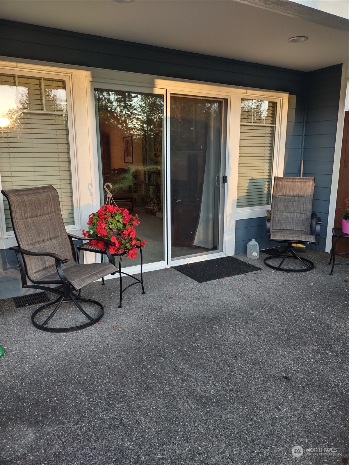 160 East Soderberg Road, Unit G19 Allyn, WA 98524 - Photo 32 of 38 a living room with furniture and a floor to ceiling window
