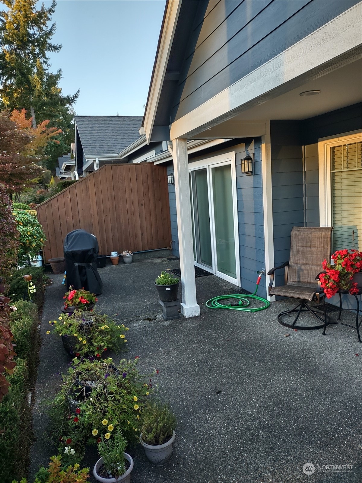 160 East Soderberg Road, Unit G19 Allyn, WA 98524 - Photo 33 of 38 a view of a backyard with sitting area and furniture