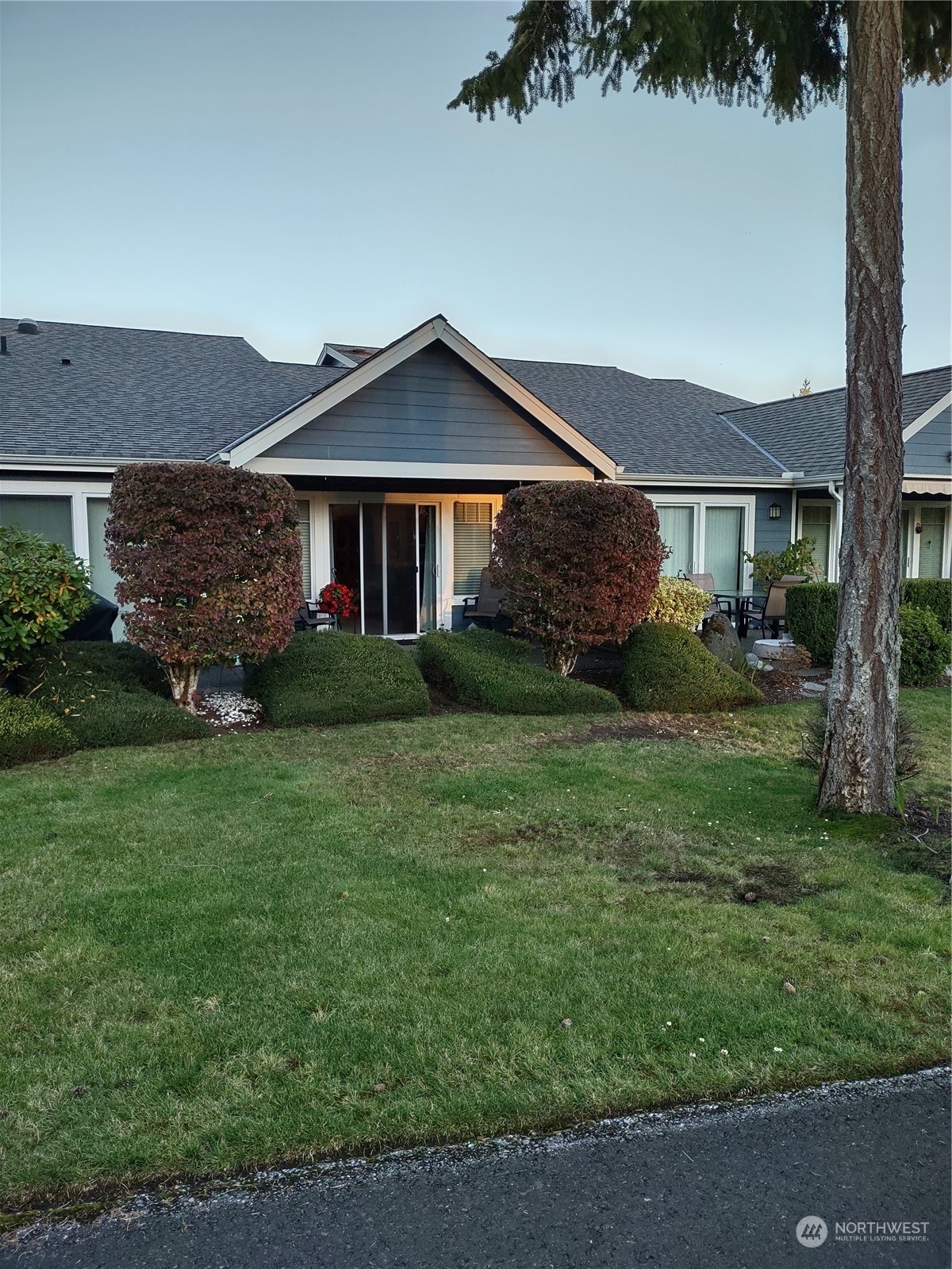 160 East Soderberg Road, Unit G19 Allyn, WA 98524 - Photo 34 of 38 front view of a house with a yard