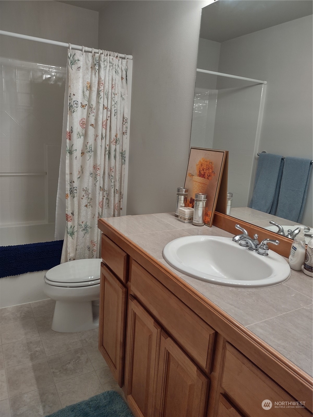 160 East Soderberg Road, Unit G19 Allyn, WA 98524 - Photo 6 of 38 a bathroom with a sink a toilet and shower