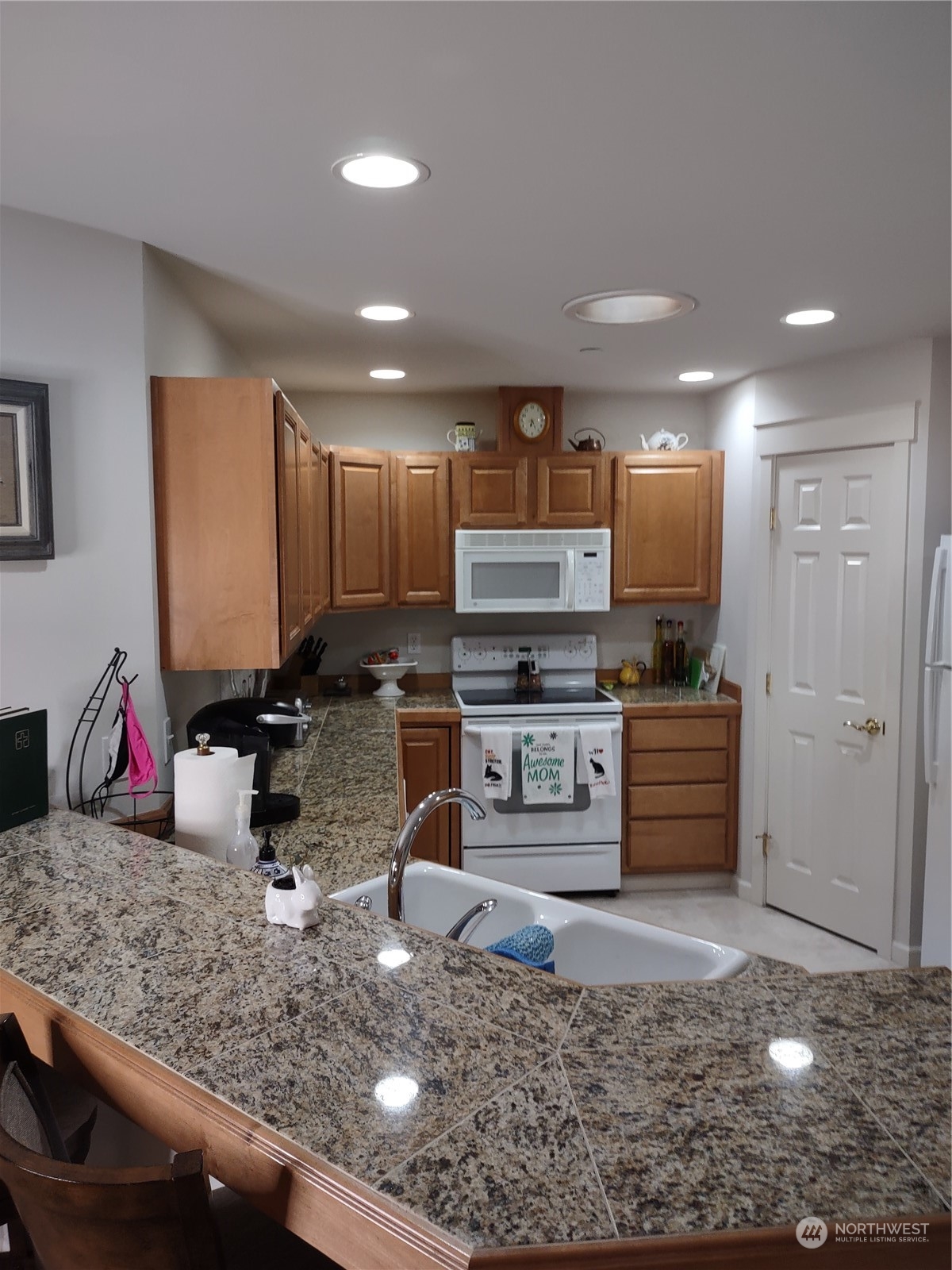 160 East Soderberg Road, Unit G19 Allyn, WA 98524 - Photo 8 of 38 a kitchen with stainless steel appliances granite countertop a sink stove and refrigerator