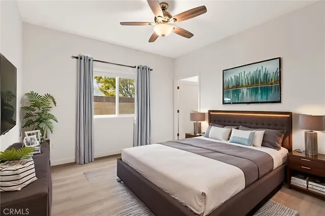 a bedroom with a bed and a window