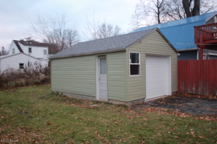 3606 Shelby Road Youngstown, OH 44511 - Photo 23 of 33 View of outdoor structure with a lawn and a garage