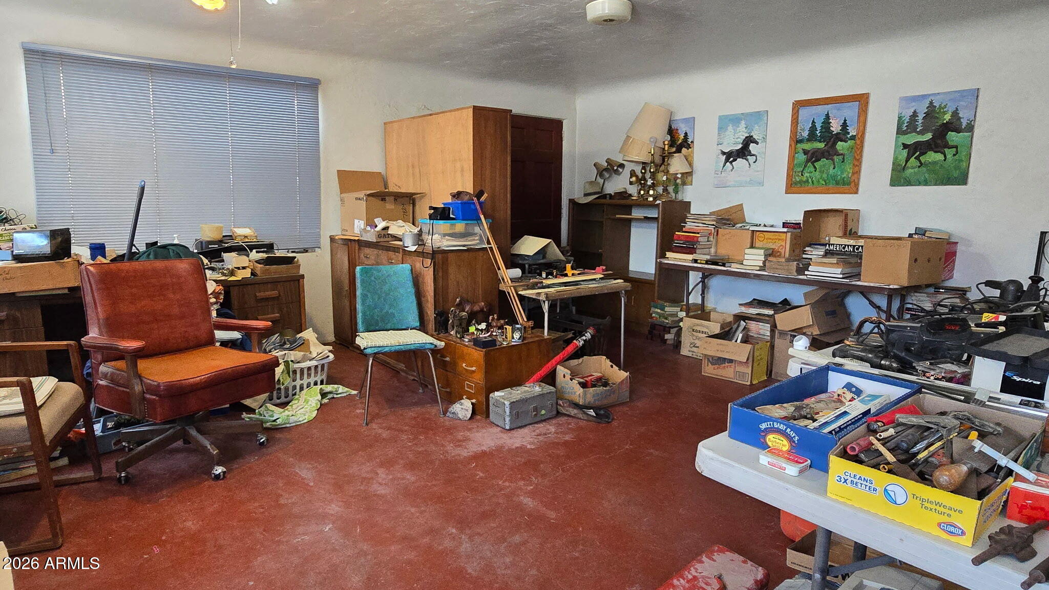 6803 South Miller Road Buckeye, AZ 85326 - Photo 10 of 50 a workspace with furniture and a wooden floor